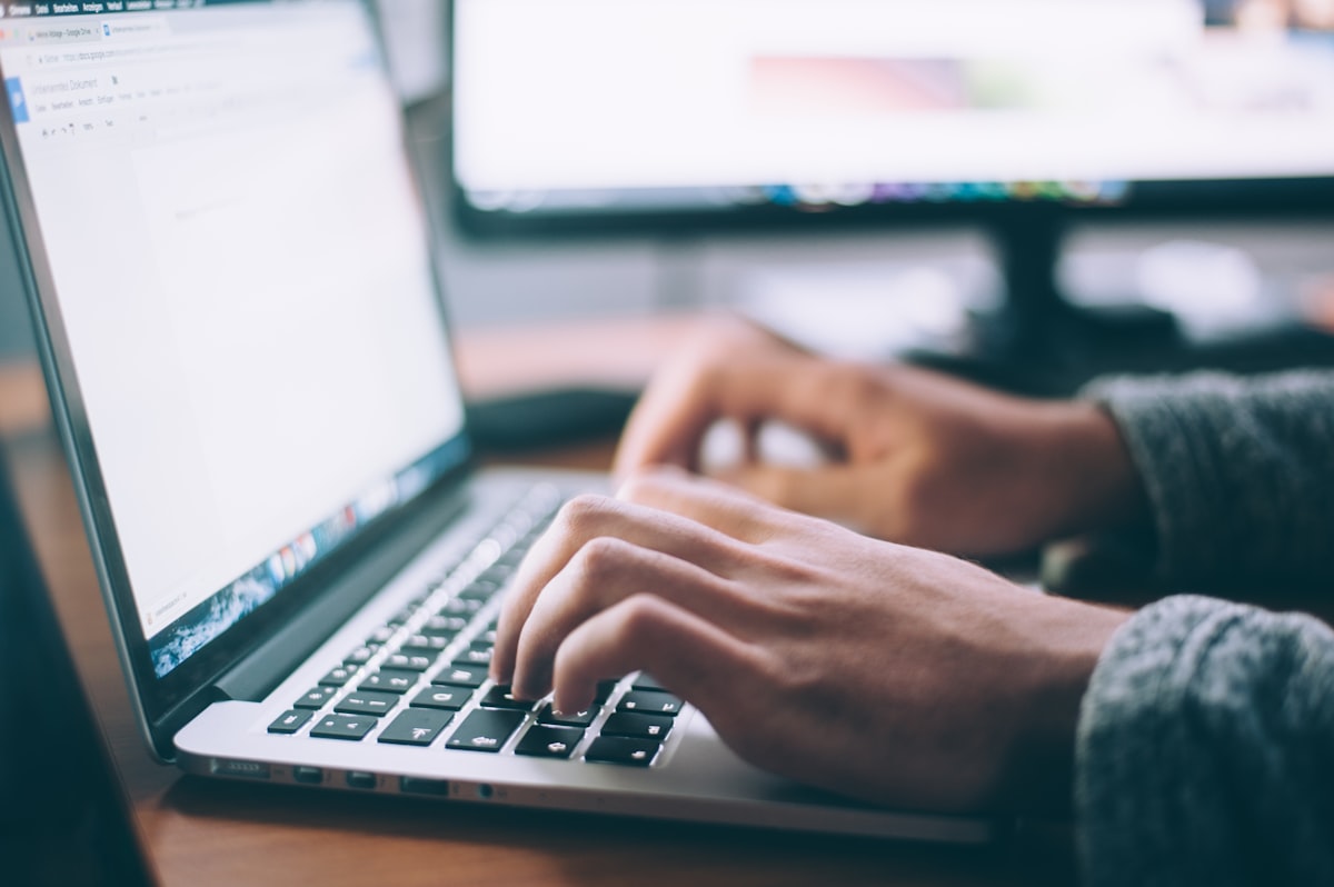 Productive web designer working efficiently at a laptop